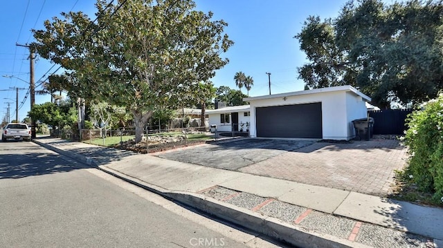 ranch-style house featuring a garage