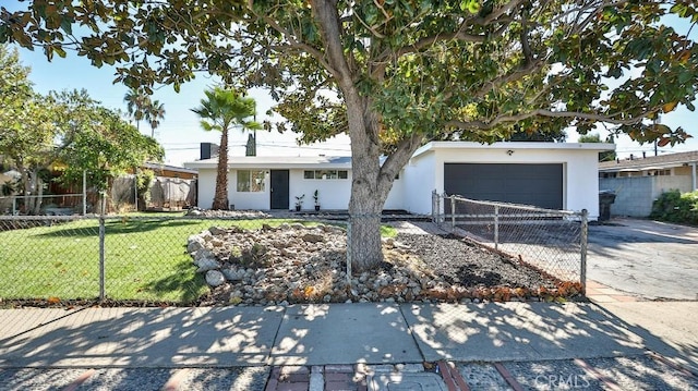 single story home with a garage and a front yard