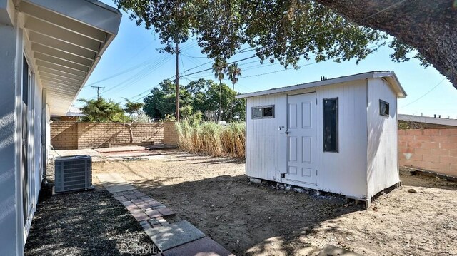 view of outbuilding with central air condition unit