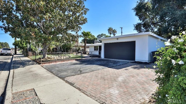 single story home with a garage