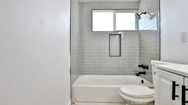full bathroom featuring vanity, toilet, and tiled shower / bath combo