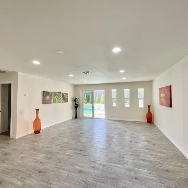 spare room with light hardwood / wood-style floors