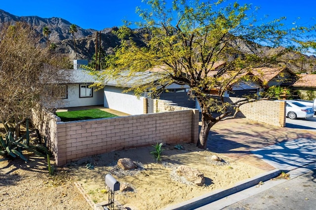 view of side of property featuring a mountain view