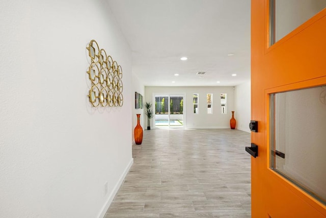 hallway featuring light wood-type flooring