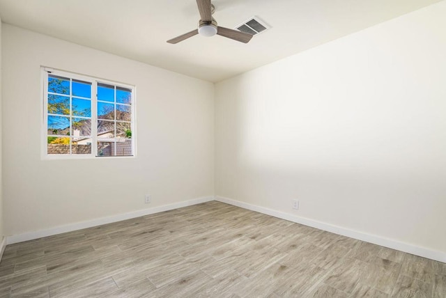 spare room with ceiling fan and light hardwood / wood-style floors