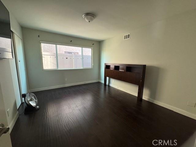 empty room featuring dark hardwood / wood-style floors