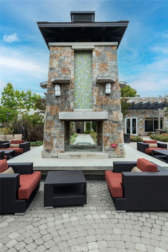 5550 Boardwalk Unit 102, Hawthorne, CA 90250 - view of patio / terrace featuring an outdoor stone fireplace