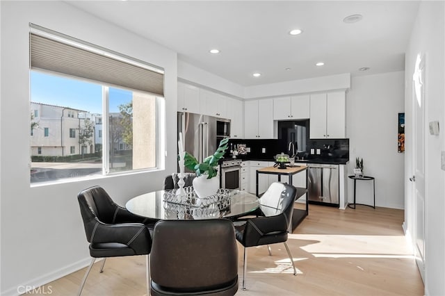 5550 Boardwalk Unit 102, Hawthorne, CA 90250 - dining space featuring light wood-style floors, baseboards, and recessed lighting