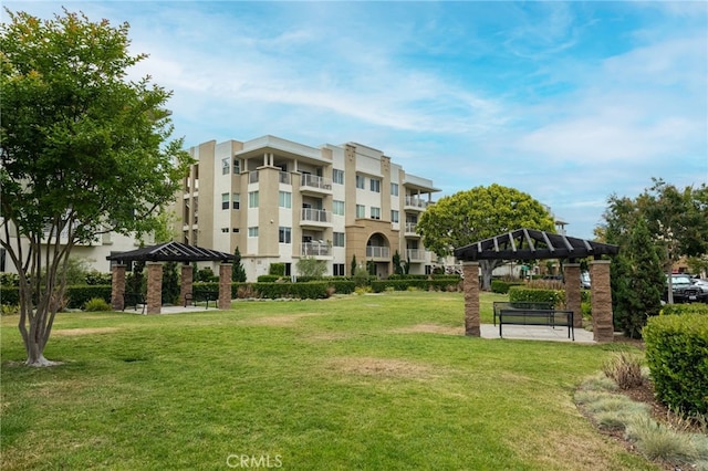 view of home's community with a yard and a gazebo