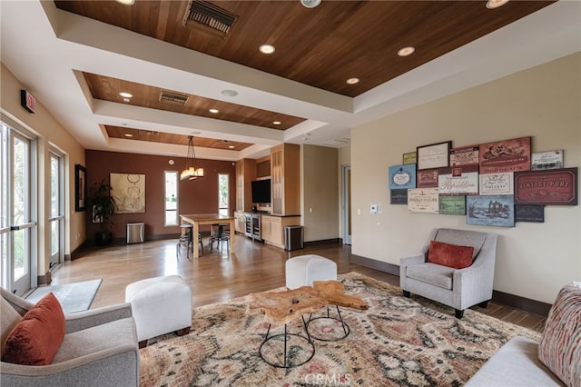 5550 Boardwalk Unit 102, Hawthorne, CA 90250 - living area featuring a tray ceiling, wooden ceiling, wood finished floors, recessed lighting, and a chandelier