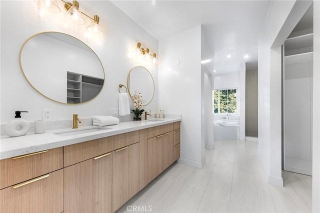 bathroom with vanity and a tub to relax in