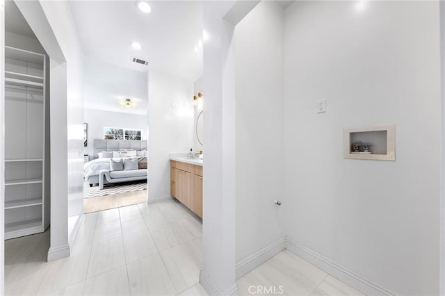 bathroom featuring tile patterned floors and vanity