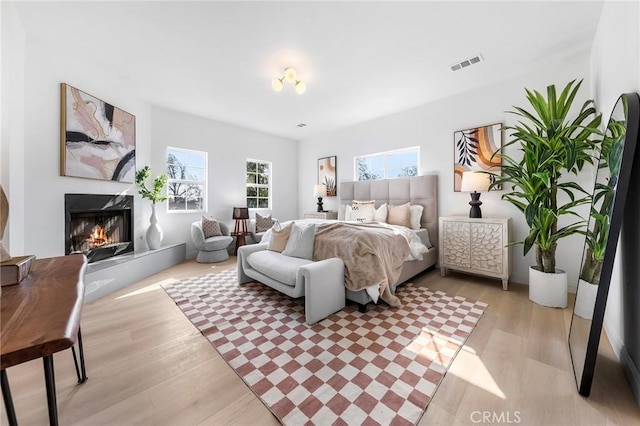 bedroom with light wood-type flooring