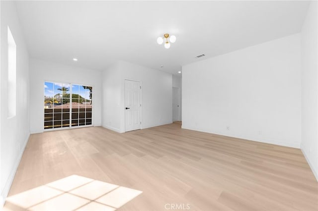 unfurnished room featuring light wood-type flooring