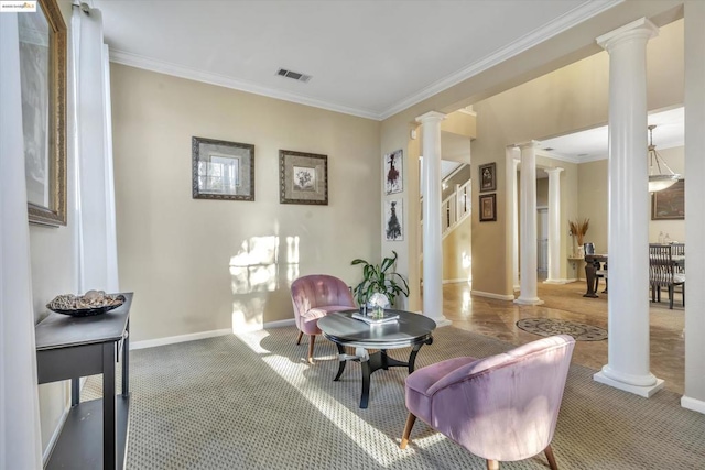 living area with carpet floors, crown molding, and ornate columns