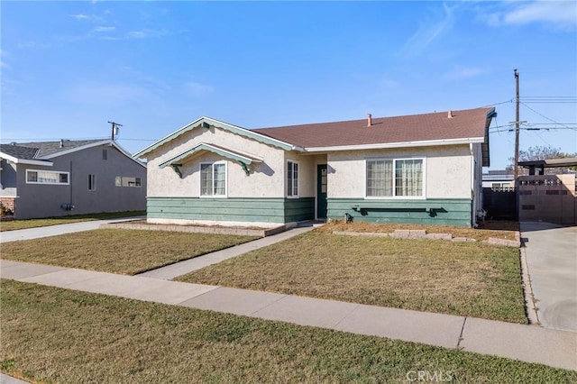 ranch-style house featuring a front lawn