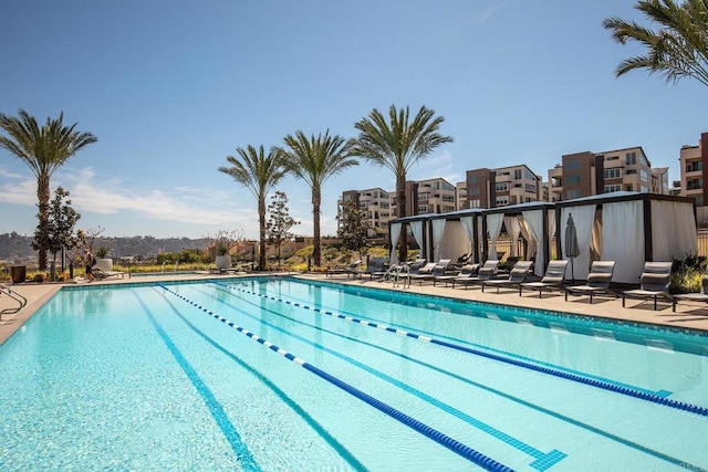 community pool with a patio area