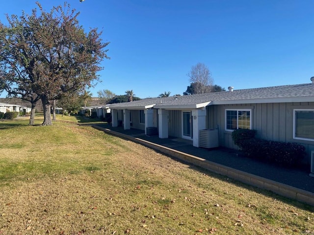 view of property exterior with a lawn