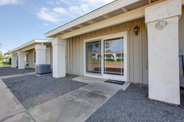 doorway to property featuring a patio and central air condition unit