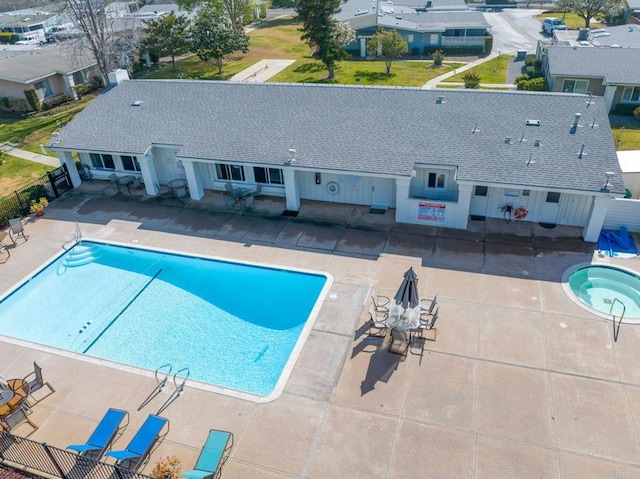 view of swimming pool with a patio