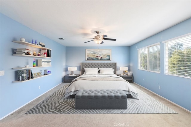 carpeted bedroom featuring ceiling fan