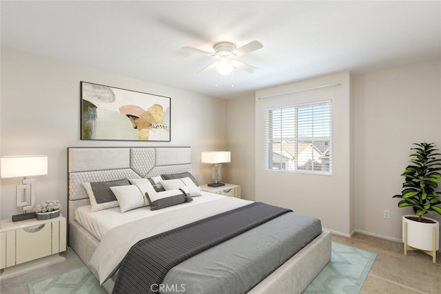 bedroom featuring ceiling fan and light colored carpet