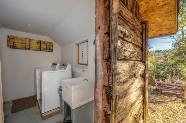 laundry area featuring sink and washing machine and clothes dryer