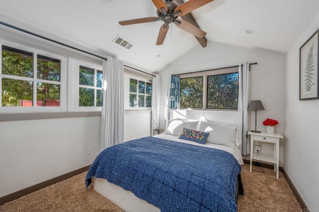 bedroom featuring carpet flooring, vaulted ceiling with beams, and ceiling fan