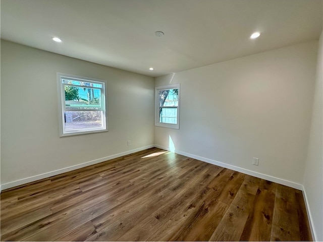 unfurnished room featuring hardwood / wood-style floors