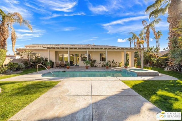 view of swimming pool featuring a pergola, a lawn, a patio, and an in ground hot tub