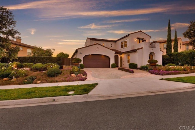 mediterranean / spanish-style house featuring a garage