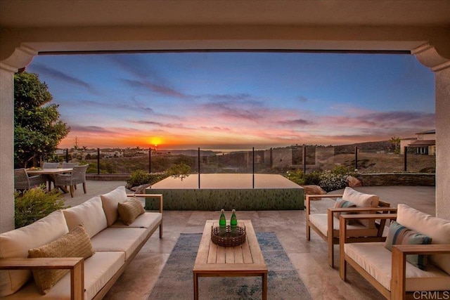 patio terrace at dusk with outdoor lounge area