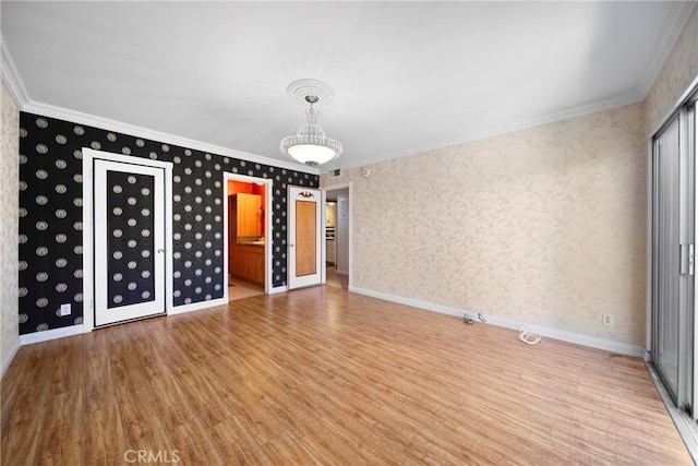 interior space featuring hardwood / wood-style flooring and ornamental molding