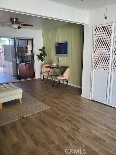 bedroom with dark hardwood / wood-style floors