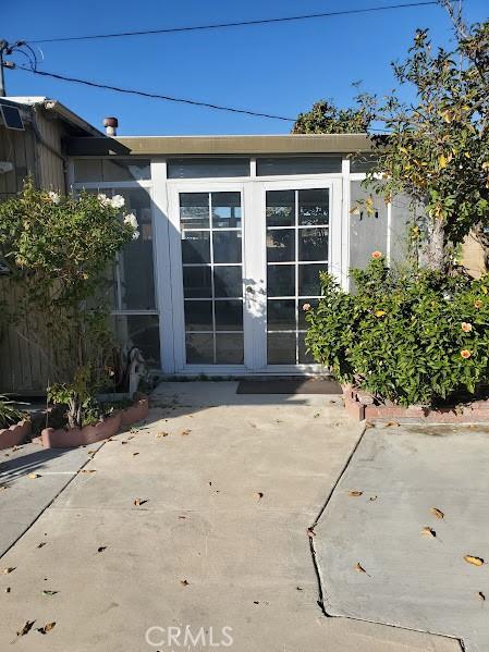 doorway to property featuring a patio and french doors