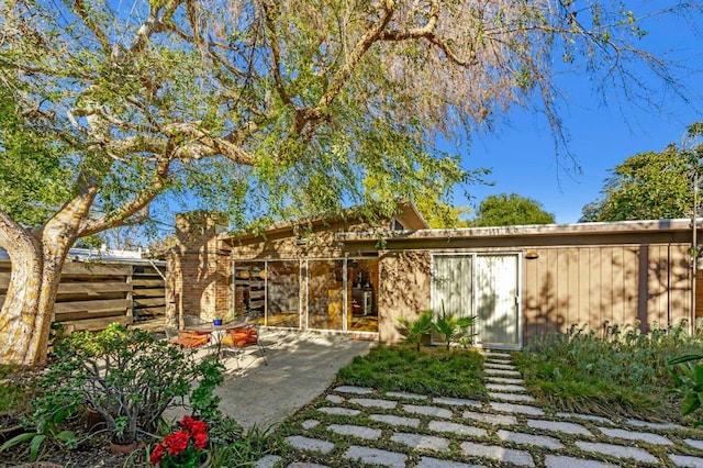 back of property with a patio area