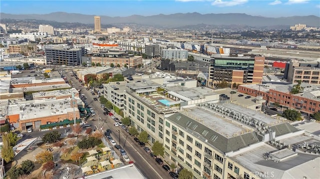 property's view of city with a mountain view