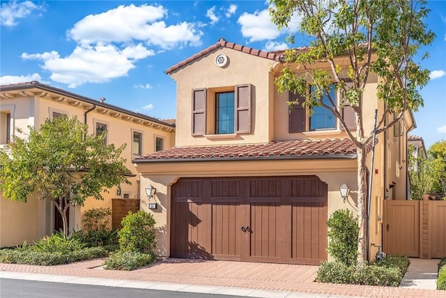 mediterranean / spanish-style home featuring a garage