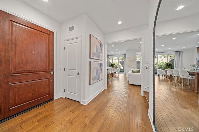 foyer entrance featuring light hardwood / wood-style floors