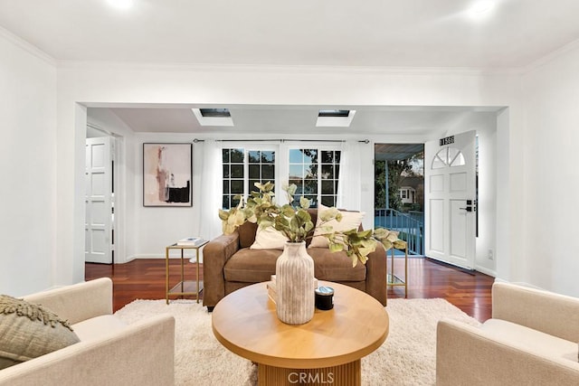 living room featuring dark hardwood / wood-style flooring and crown molding