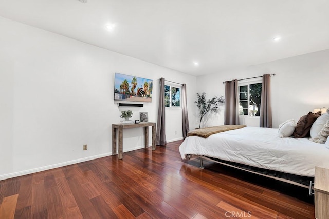 bedroom featuring dark wood-type flooring