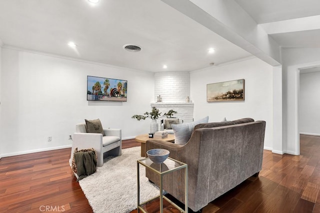 living room featuring dark hardwood / wood-style floors and crown molding