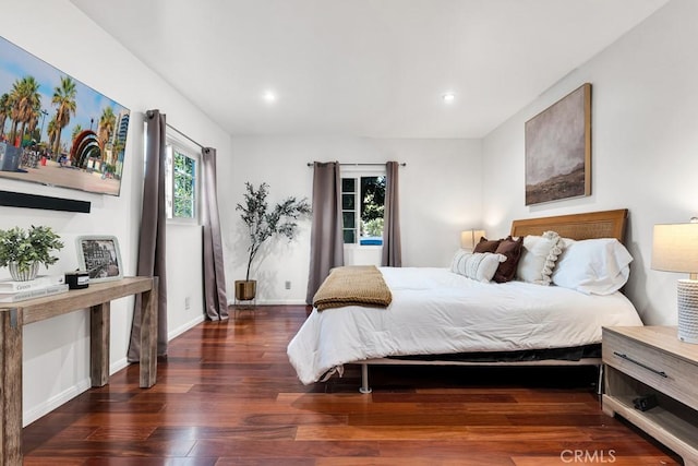 bedroom featuring dark hardwood / wood-style flooring