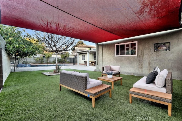 view of patio with outdoor lounge area and a fenced in pool