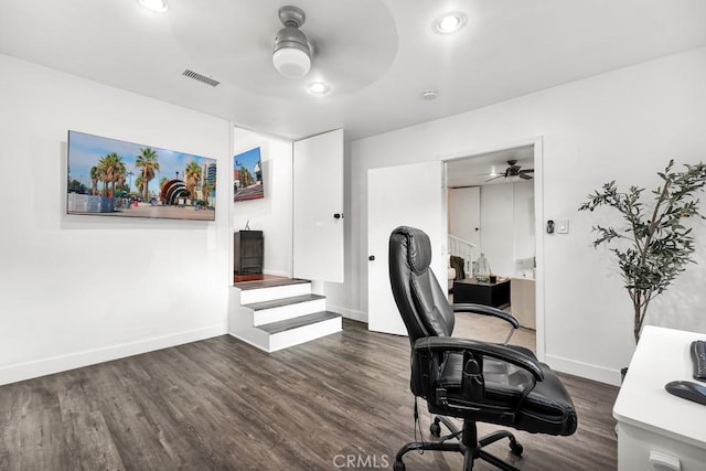 office space featuring dark hardwood / wood-style flooring and ceiling fan