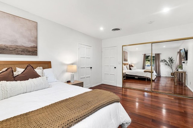 bedroom featuring dark wood-type flooring