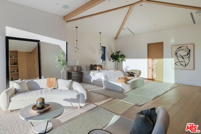 living room featuring beamed ceiling, wood-type flooring, and high vaulted ceiling