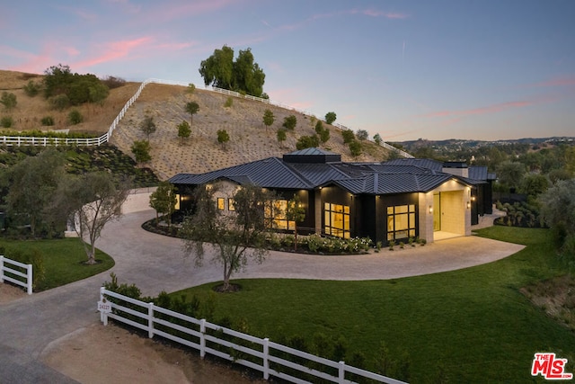 view of front of house with a yard