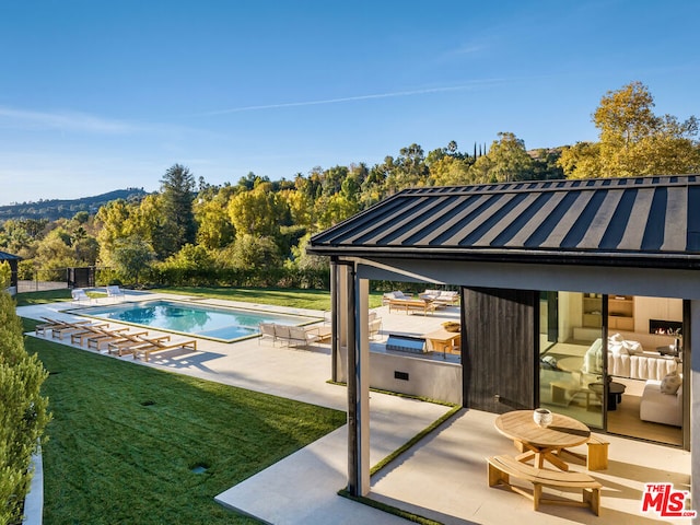 view of pool featuring a lawn, a gazebo, and a patio