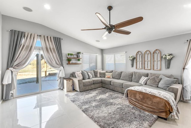 living room featuring ceiling fan and lofted ceiling